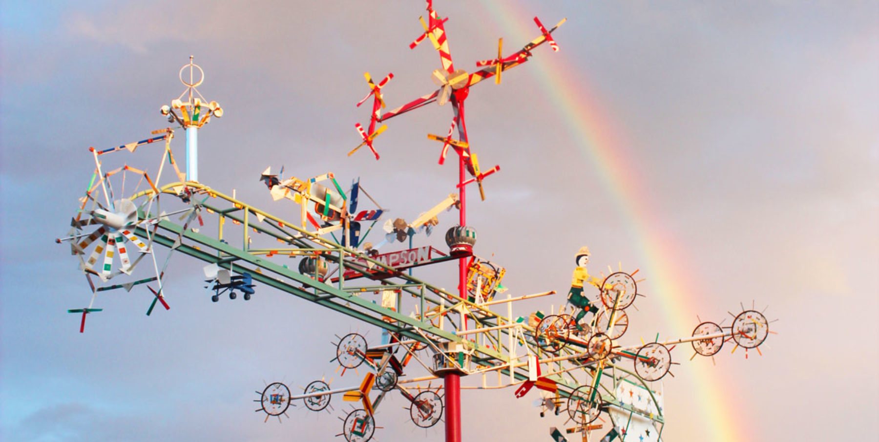 Beautiful whirligig with a rainbow behind it - Discover Wilson