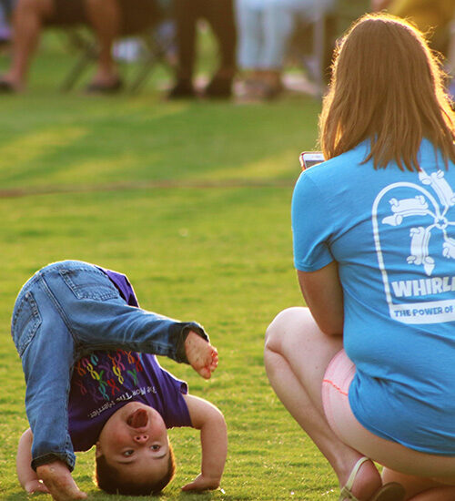 Child at Wilson, NC, event doing a somersault - Discover Wilson